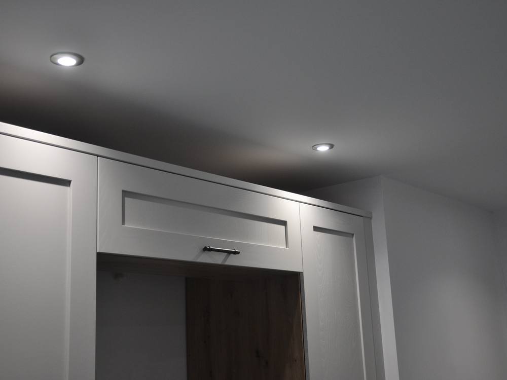 Recessed LED downlights in a hallway with fitted cabinetry